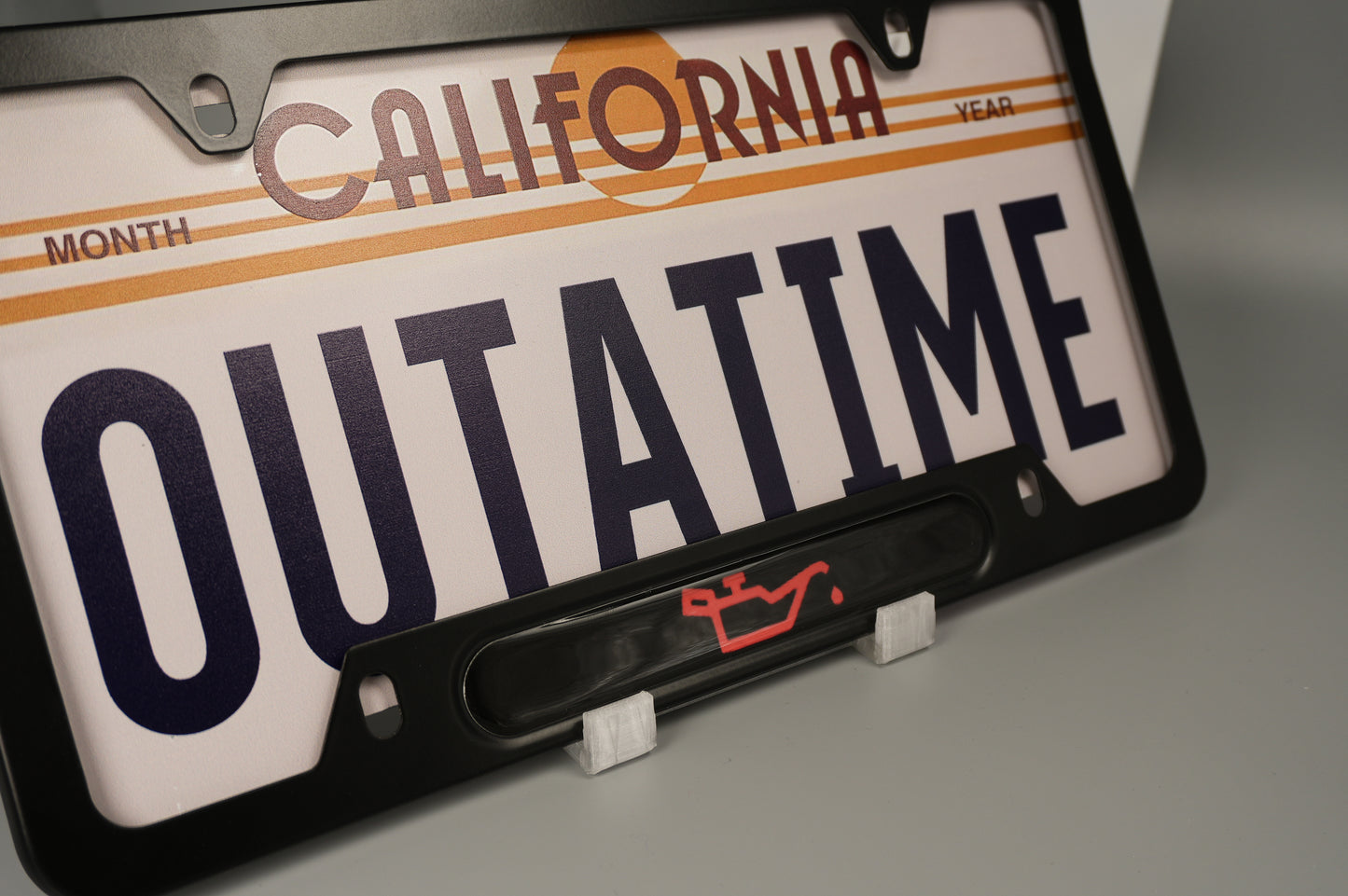 License plate frame aluminum CEL - LOW OIL